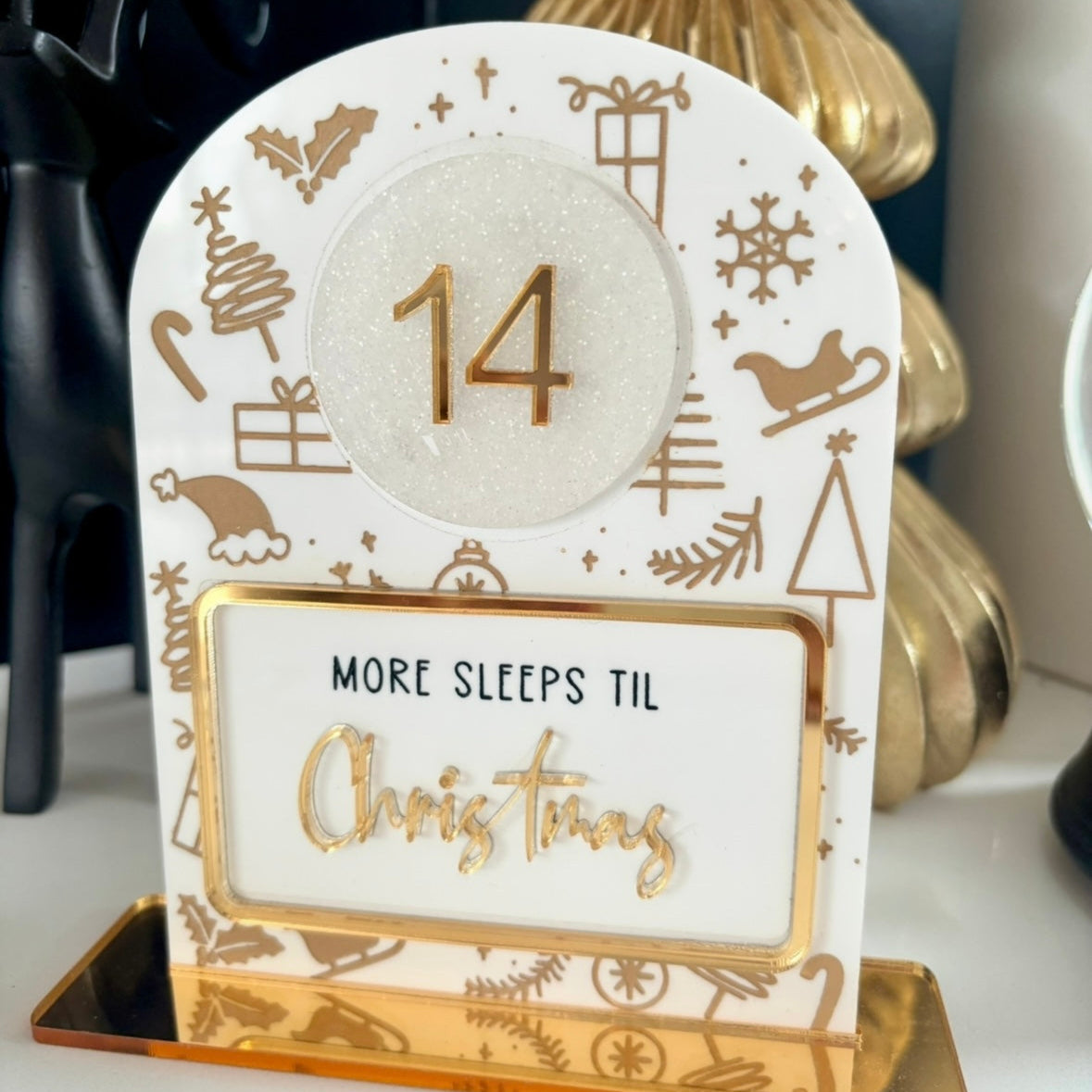 Christmas countdown timer with '14' days until Christmas on a white background.