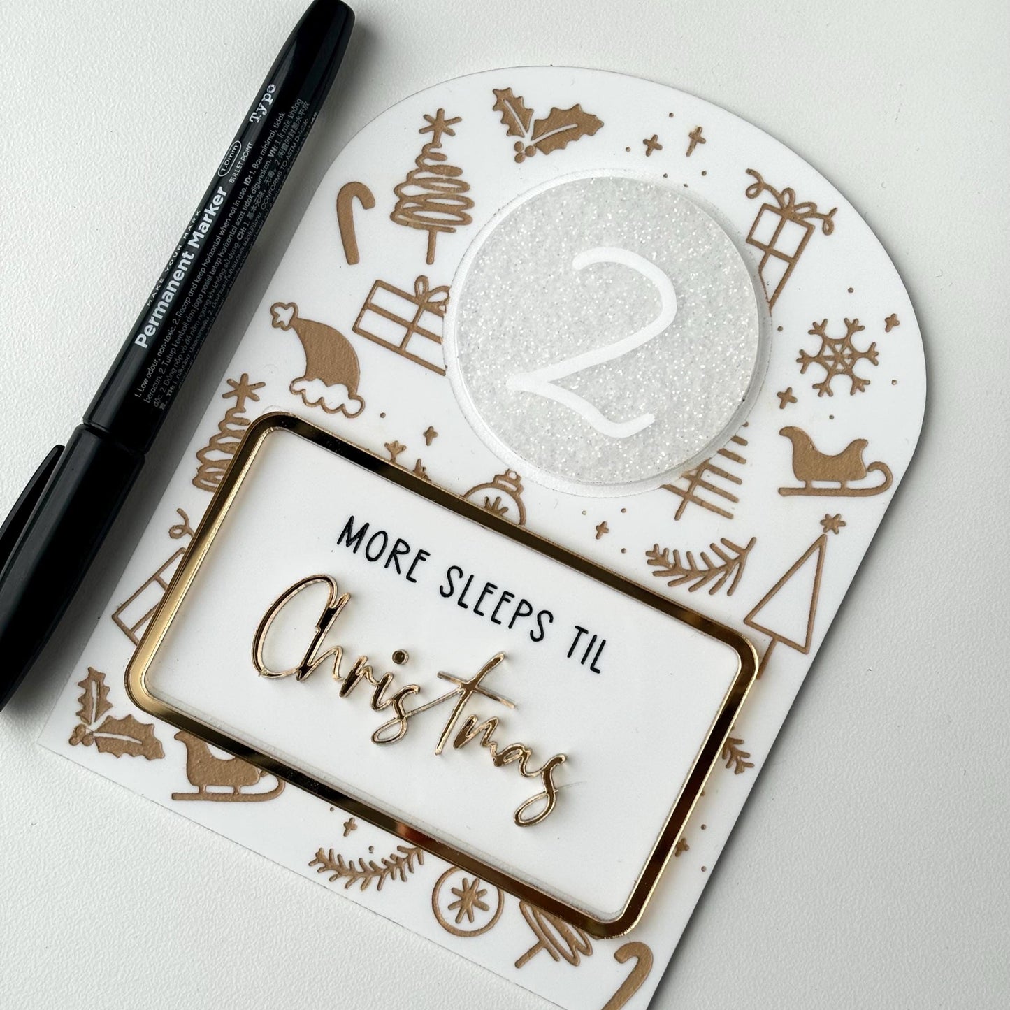 Christmas countdown acrylic sign with pen and white disc on a white background