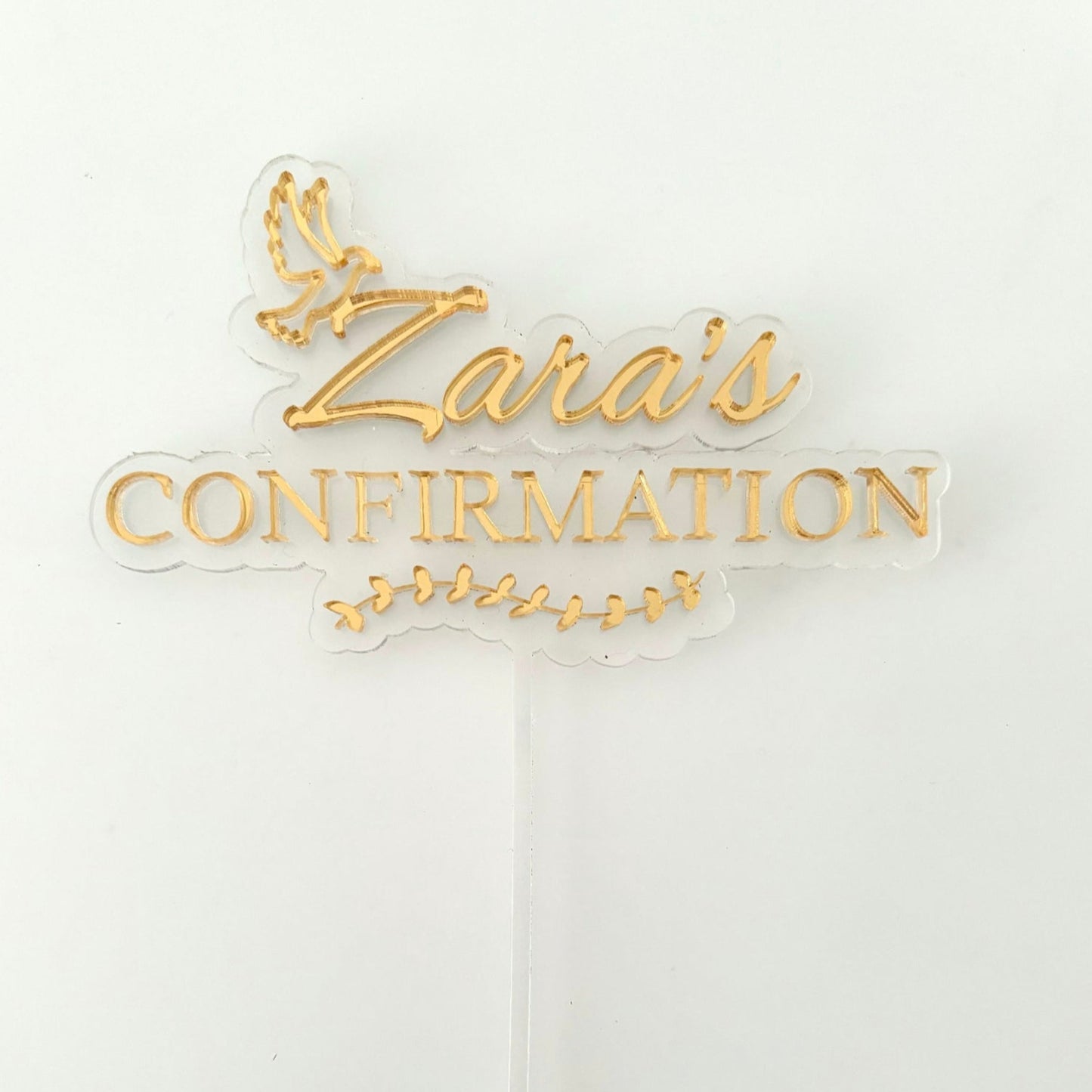 Gold 'Zara's Confirmation' Acrylic Cake Topper on a white background.