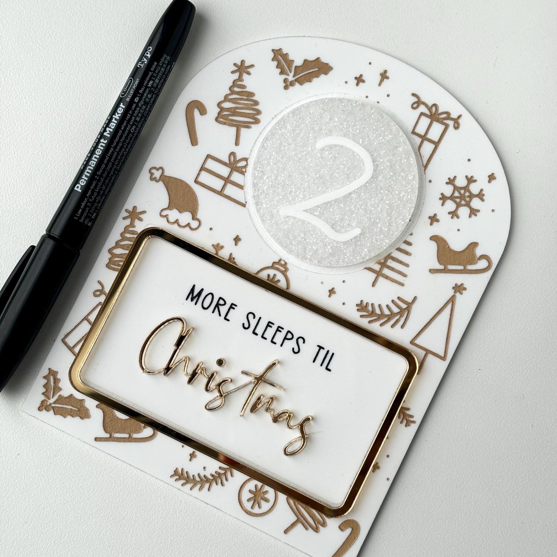 Christmas countdown acrylic sign with pen and white disc on a white background