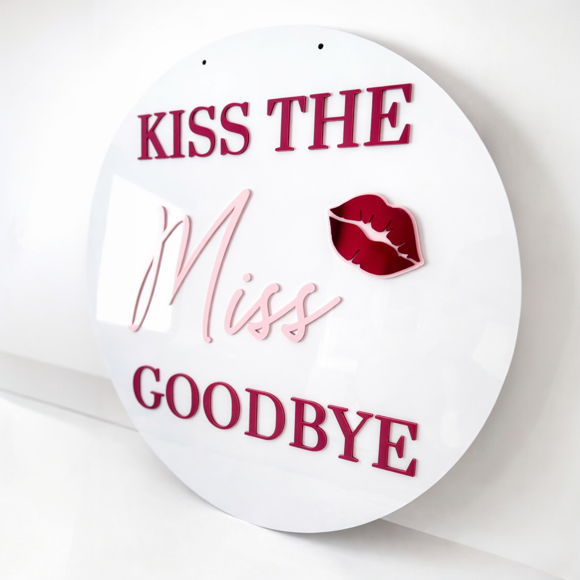 60cm Circle sign with 'Kiss the Miss Goodbye' text and a lipstick kiss mark on a white background