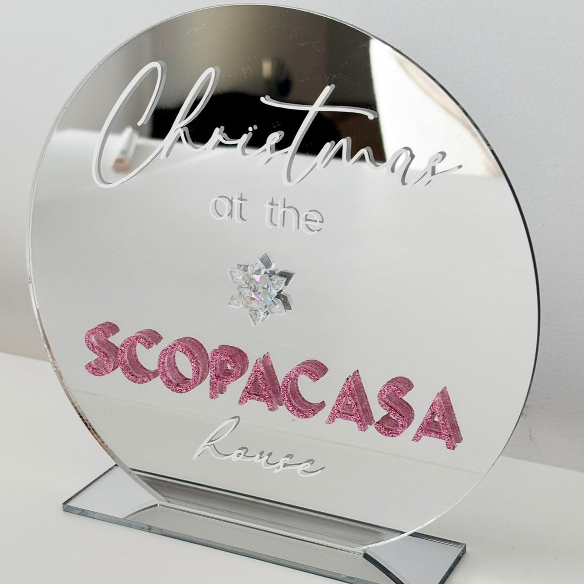 Silver Mirrored Sign with 'Christmas at the Scopacasa house' text on a stand