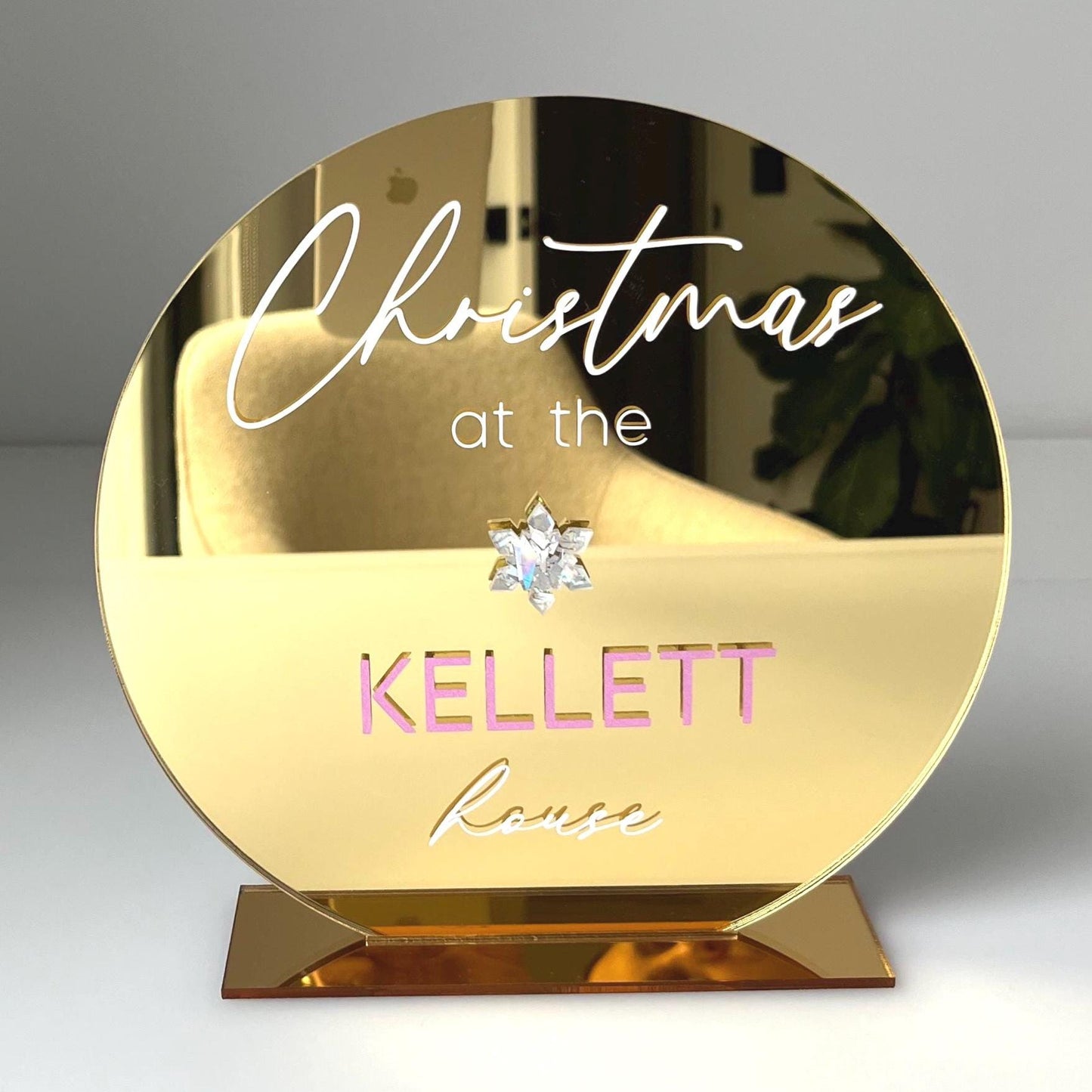 Gold mirror christmas sign with 'Christmas at the Kellett House' text on a grey background