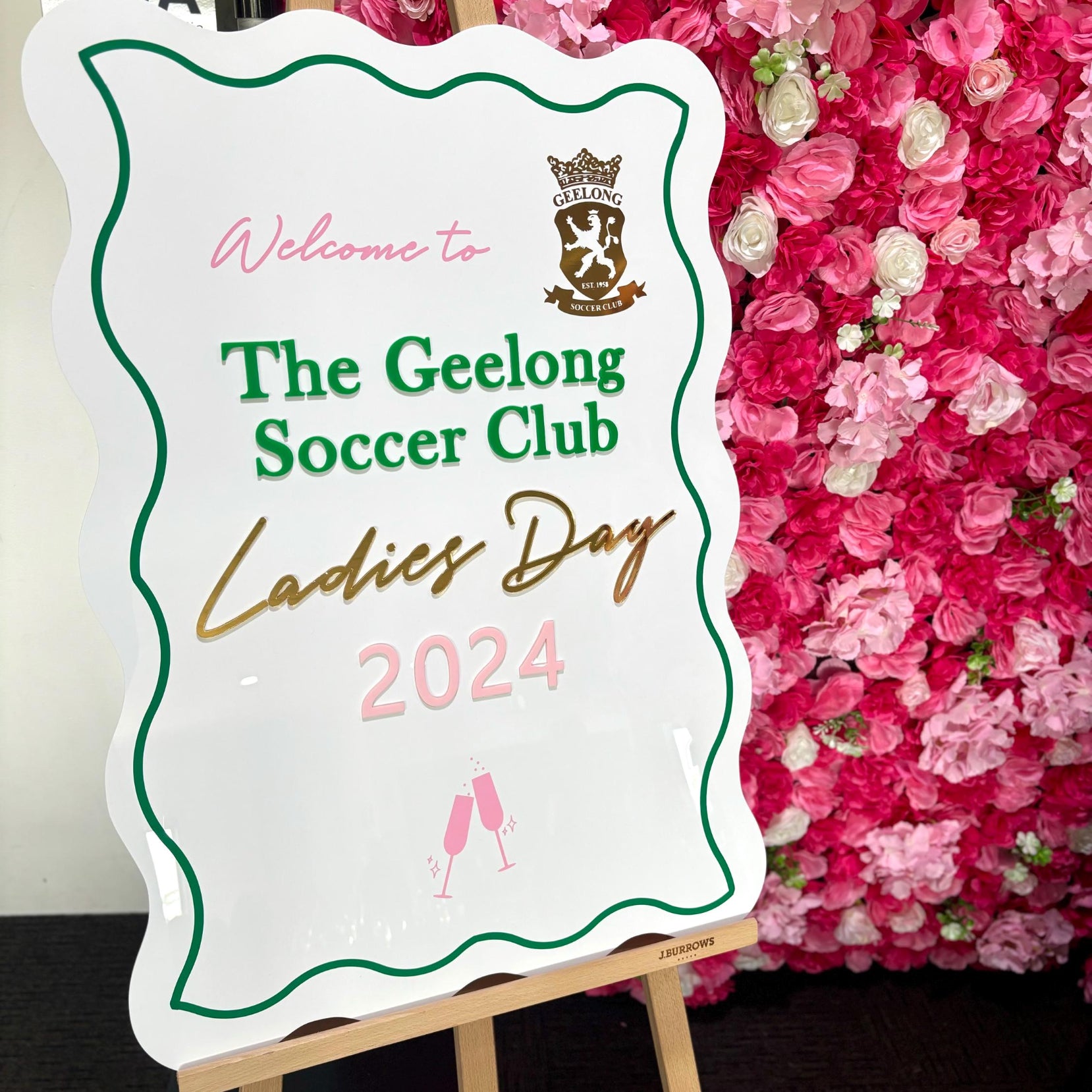 A1 Wavy Welcome Sign for The Geelong Soccer Club Ladies Day 2024 in front of a floral backdrop