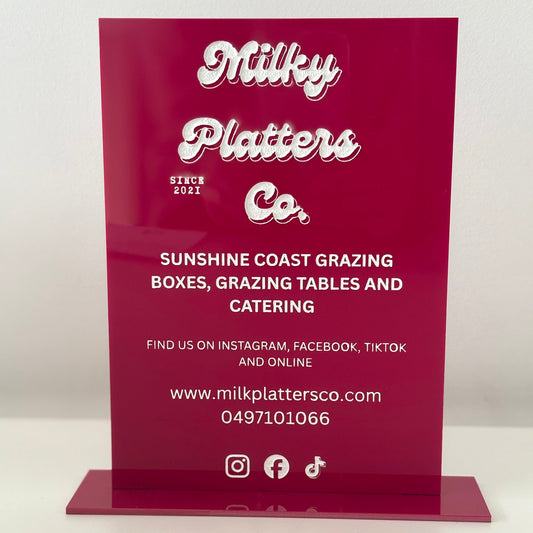 a4 business sign with 'Milky Platters Co.' branding on a white background