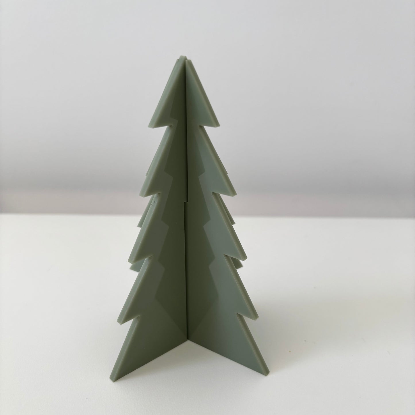Olive Green Christmas tree on a white background
