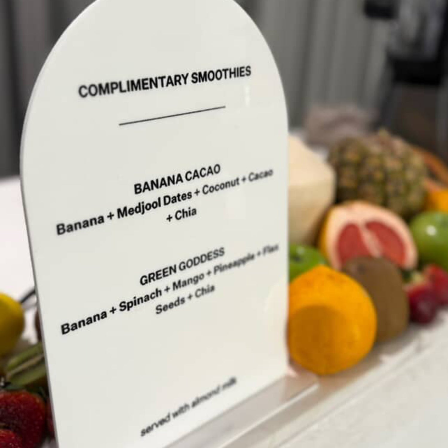 A4 Menu Signage with smoothie options in front of fresh fruits