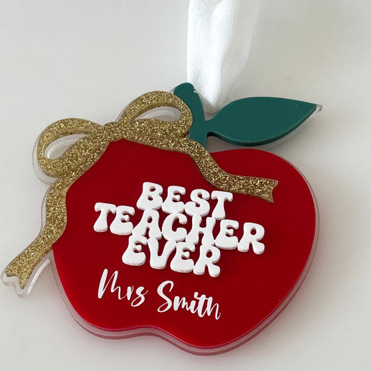 Red apple-shaped ornament with 'Best Teacher Ever' and 'Mrs Smith' text on a white background