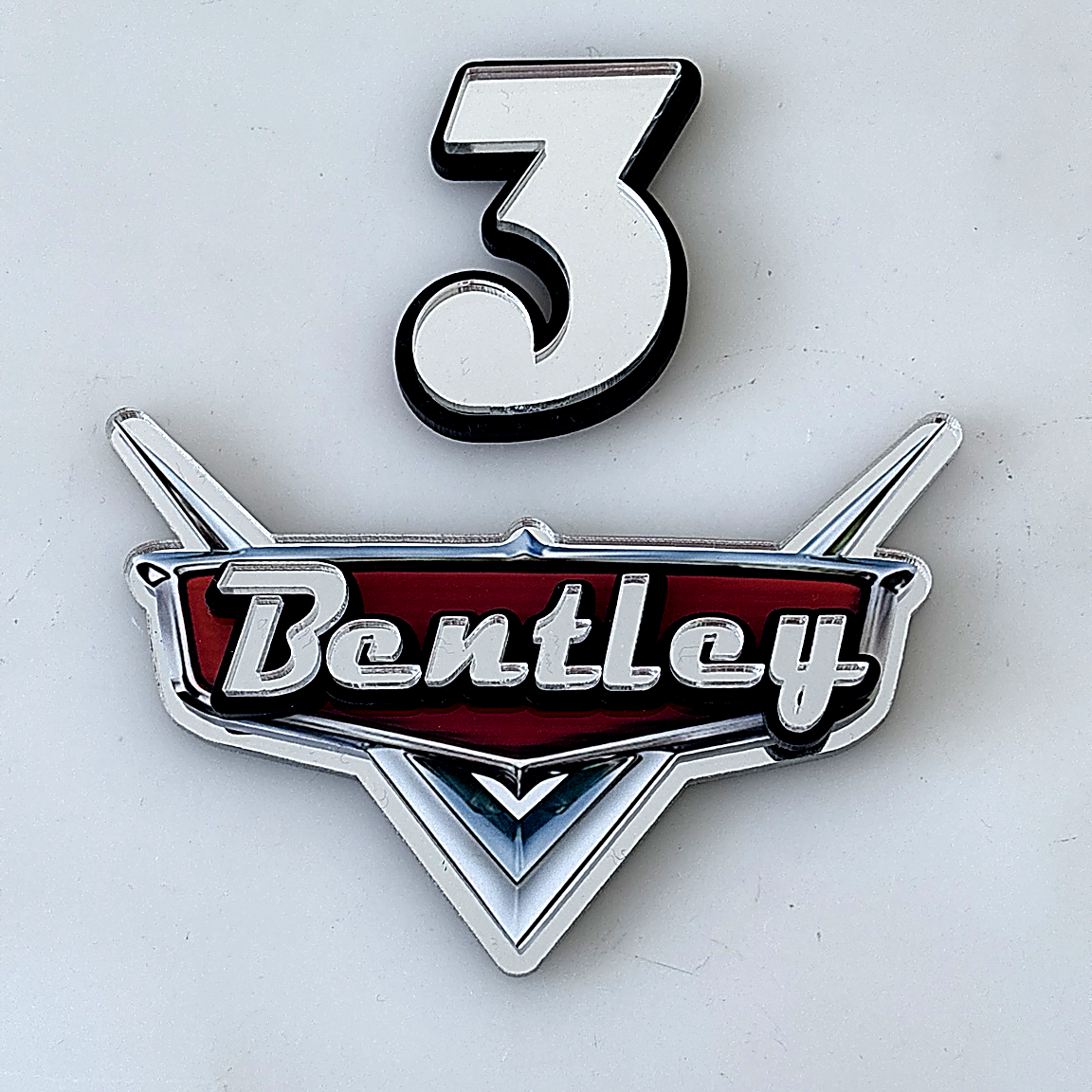 Personalised car emblem with number 3 on a white background - Disney Cars Theme.