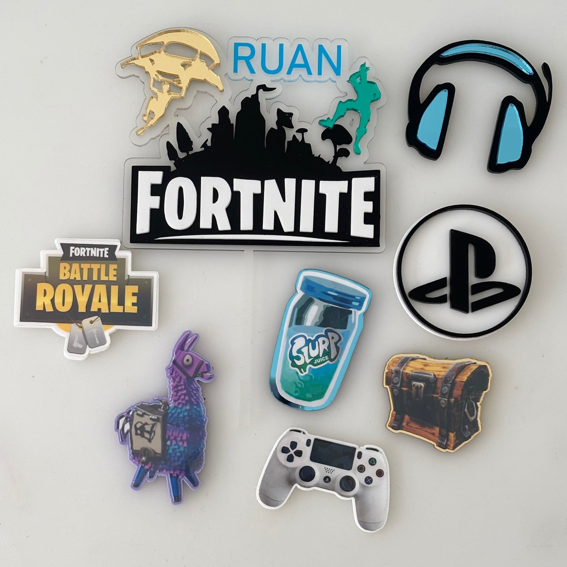 Collection of gaming-themed cake charms on a white background