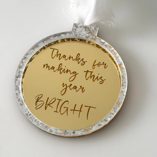 Decorative ornament with 'Thanks for making this year BRIGHT' text on a white background