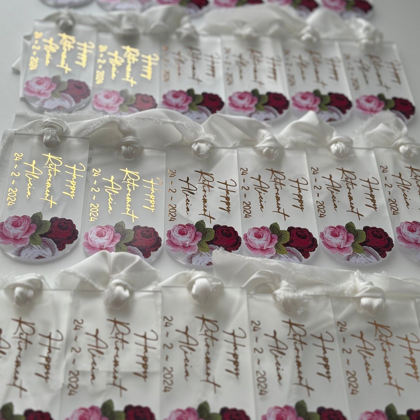 Decorative tags with floral designs and text on a white background