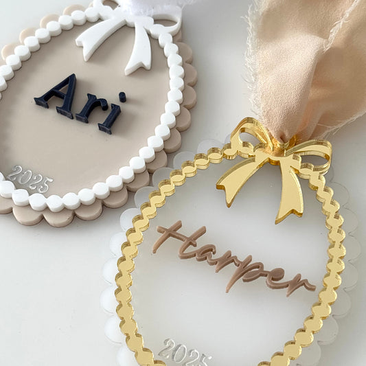Decorative Christmas name tags with 'Ari' and 'Harper' on a white background